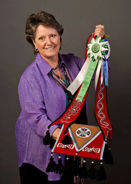 Martha Berry holding Cherokee beadwork.